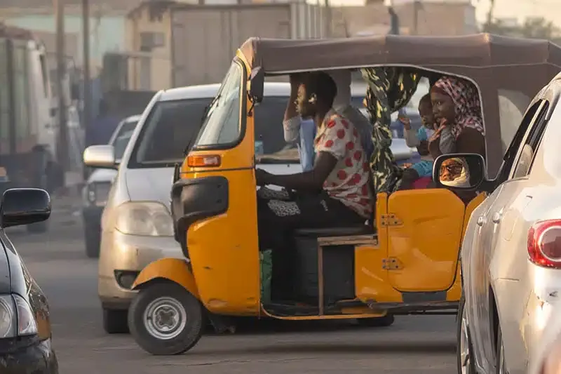 Tuktuk in Nouakchott A tuktuk carrying people through Nouakchott, Mauritania.