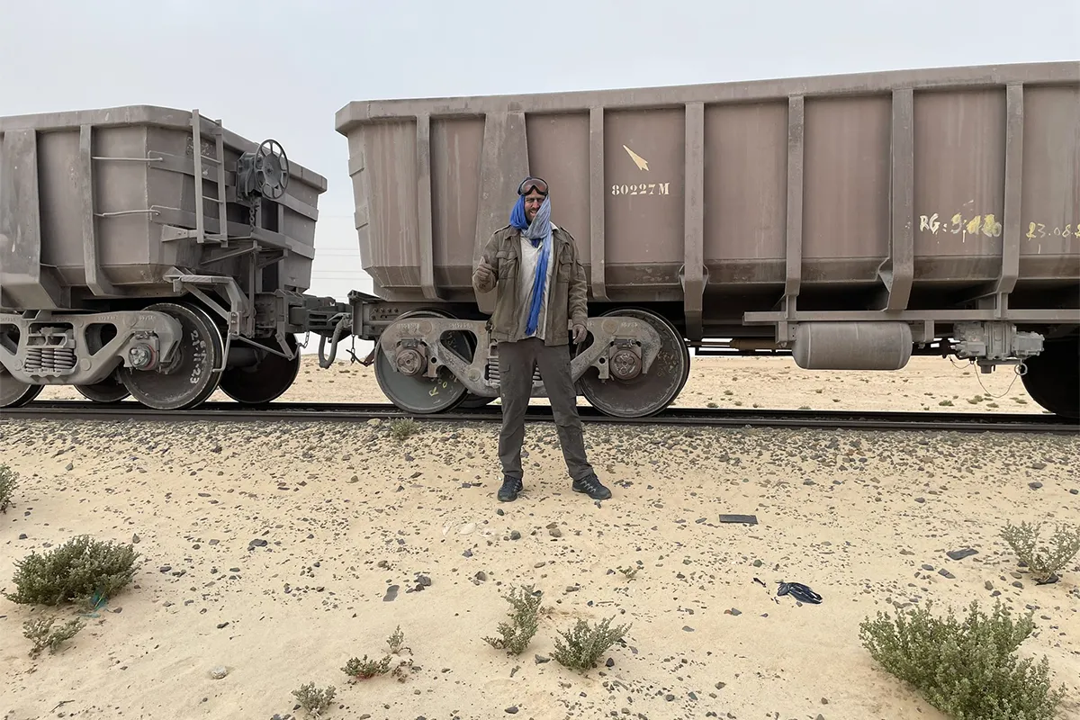 Wiebe Wakker after the Iron Ore Train Wiebe Wakker standing in front of the Mauritanian Iron Ore train after riding it for 17 hours.